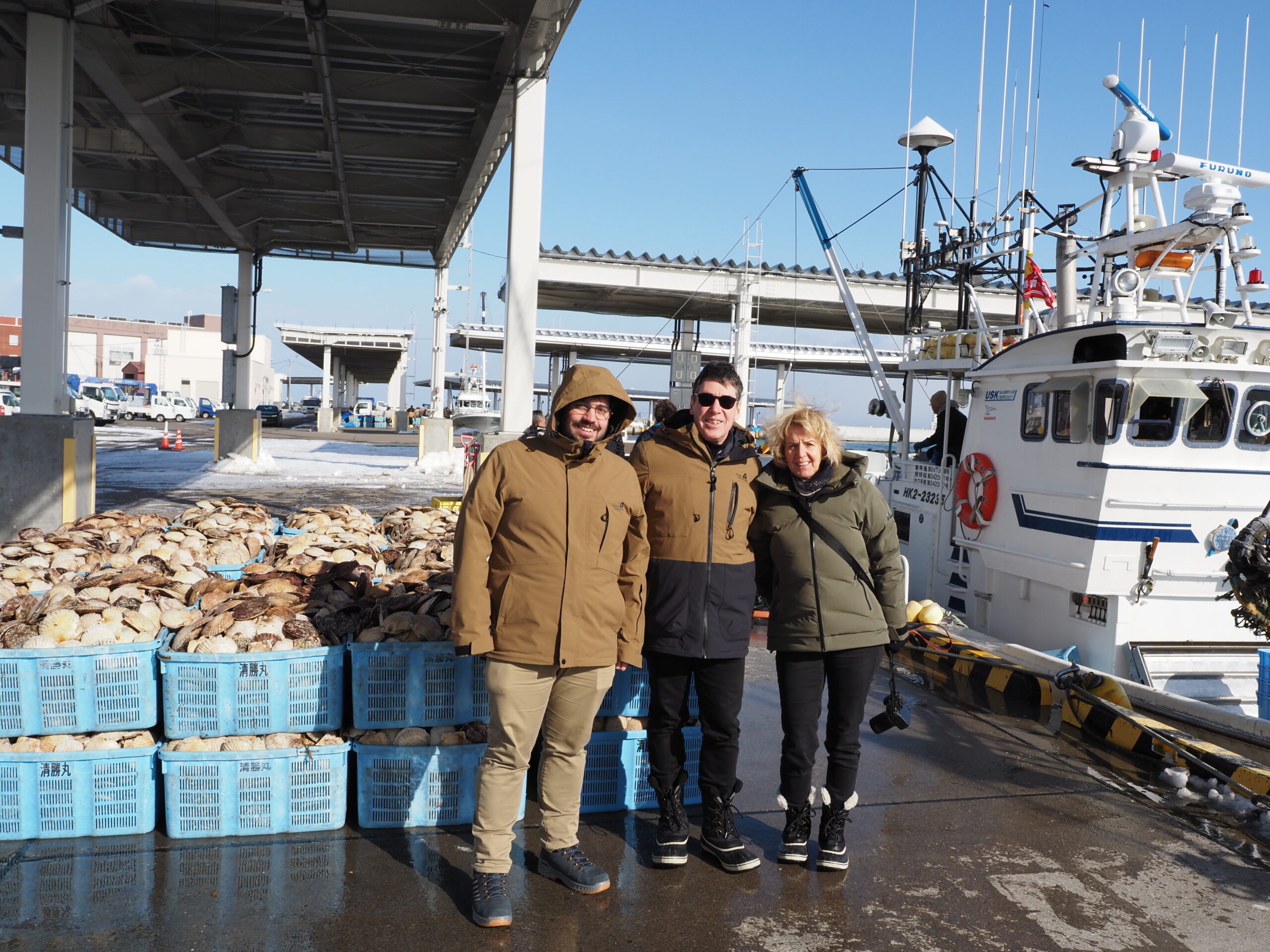 Guests visiting a local fishing port in Hokkaido